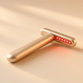 Halo eye wand in gold with a soft warm-light tip on a seamless cream backdrop